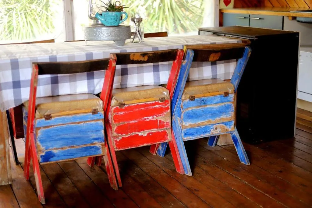 Hand-painted chairs at the communal table